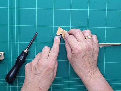 Step 2 Cut the ends straight on the leather strip