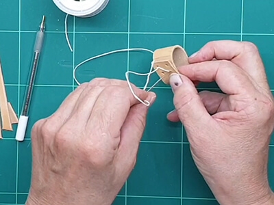 Step 8 Stitch the small leather loop in place