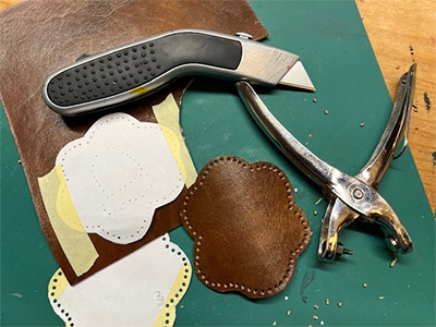 Step 2 Make holes in the leather and cut out
