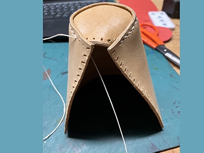 Step 8 Knot if the thread is too short or continue to sew leather pieces together