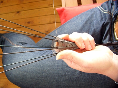 Step 2, Weave around the 7 elephant wires with wire